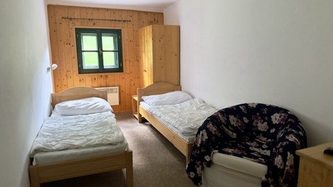 Pokoj se dvěma lůžky a posezením